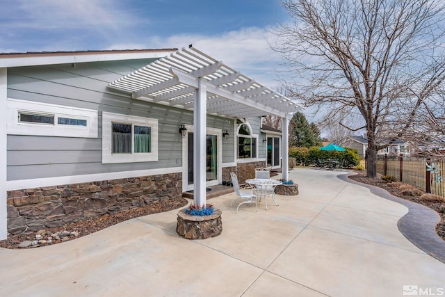 view of patio featuring fence