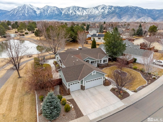 drone / aerial view featuring a residential view and a mountain view