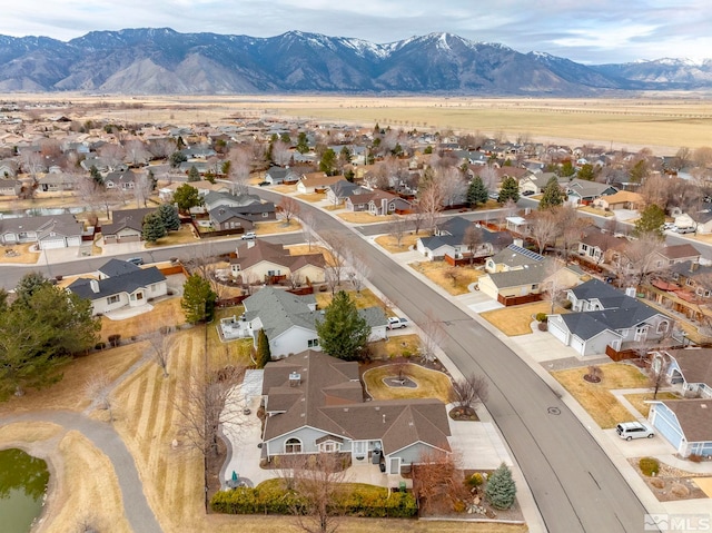 drone / aerial view with a residential view and a mountain view