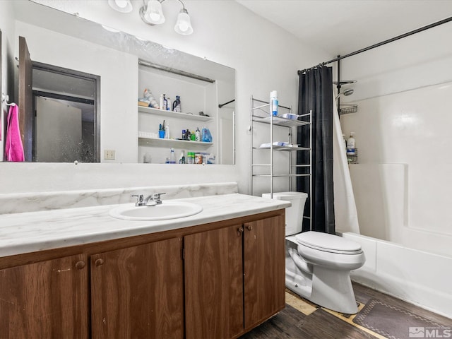 bathroom with wood finished floors, vanity, toilet, and shower / bathtub combination with curtain