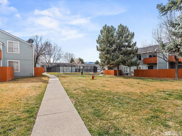 view of yard featuring fence and a residential view