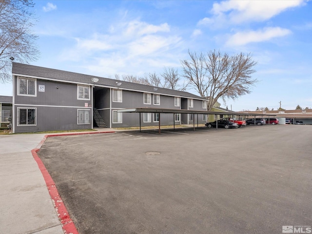 view of building exterior with covered parking