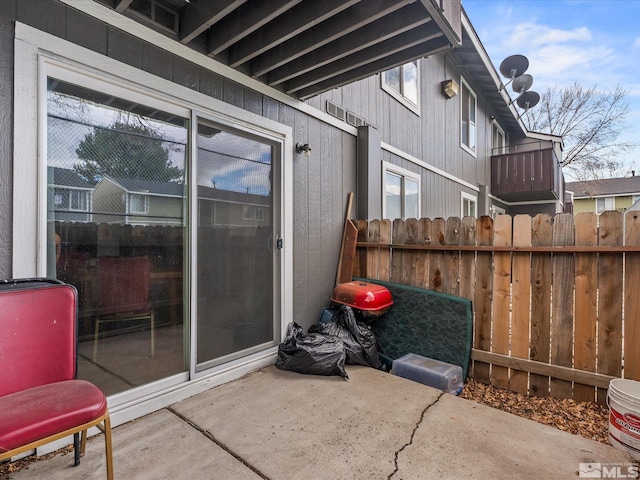 view of patio / terrace featuring fence