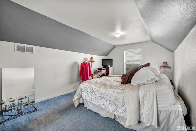 carpeted bedroom with visible vents, vaulted ceiling, a textured ceiling, and baseboards