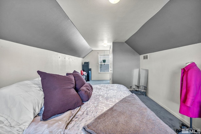 bedroom with lofted ceiling, visible vents, carpet flooring, a textured ceiling, and baseboards