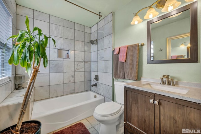 bathroom with tile patterned floors, bathing tub / shower combination, toilet, and vanity