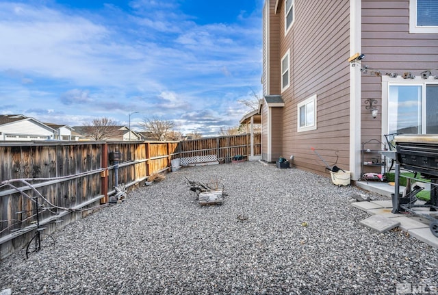 view of yard with a fenced backyard