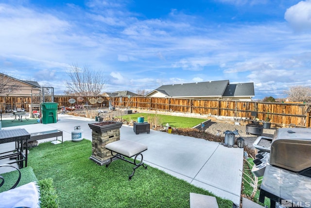 view of patio with a fenced backyard