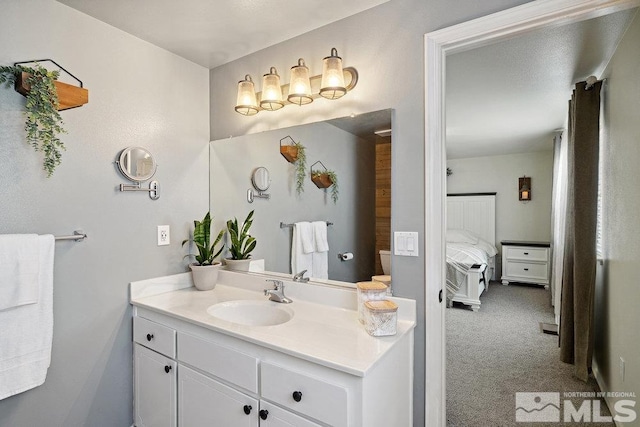 bathroom featuring connected bathroom and vanity