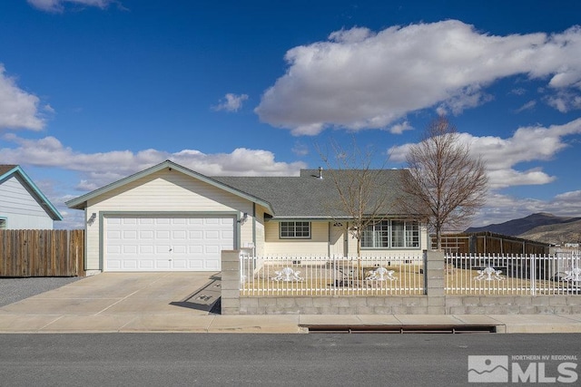 ranch-style home featuring a fenced front yard, roof with shingles, driveway, and an attached garage