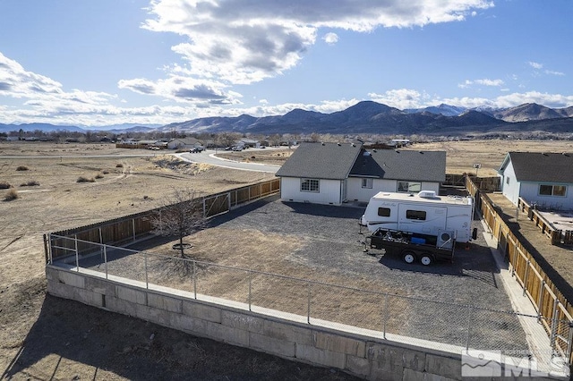 exterior space featuring fence private yard and a mountain view