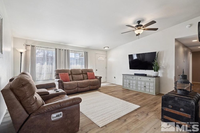 living area with ceiling fan and wood finished floors