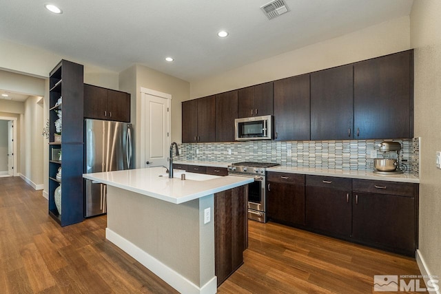 kitchen featuring open shelves, appliances with stainless steel finishes, dark wood-type flooring, and visible vents