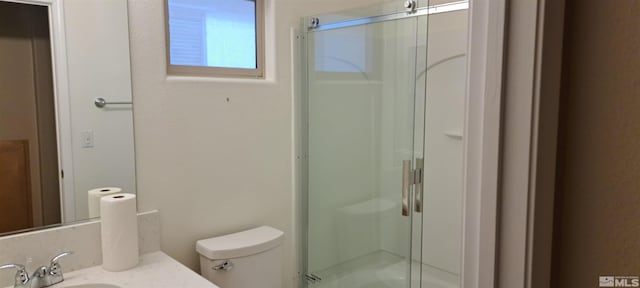 full bath featuring a shower stall, toilet, and vanity