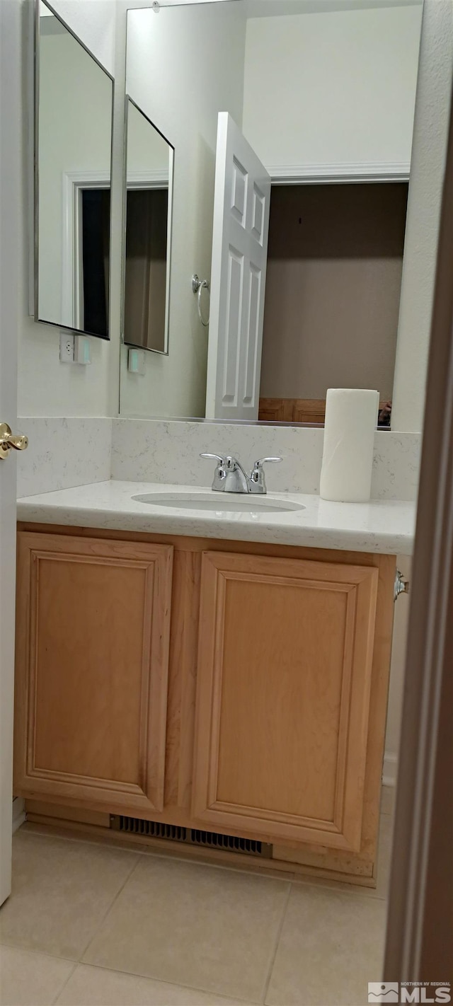 bathroom with vanity and tile patterned floors