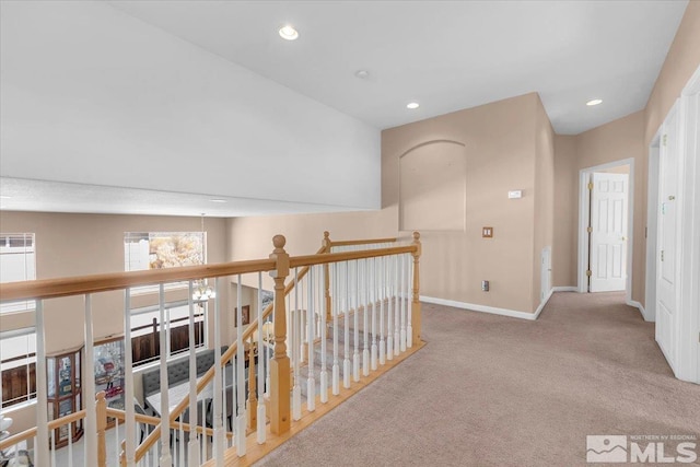 hall with carpet floors, recessed lighting, an upstairs landing, and baseboards