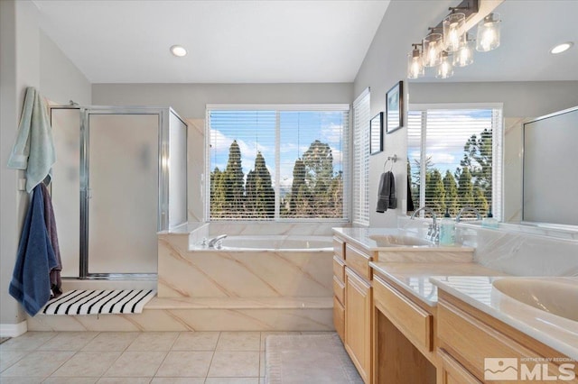 full bathroom with a stall shower, a sink, and double vanity