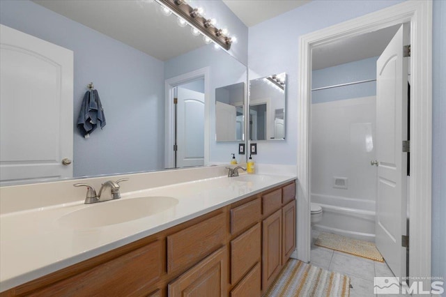 bathroom with  shower combination, tile patterned flooring, a sink, and double vanity