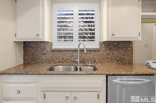 kitchen featuring dishwasher, white cabinetry, backsplash, and a sink