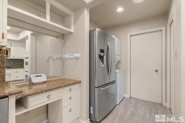 kitchen with open shelves, light wood-type flooring, white cabinets, and stainless steel fridge with ice dispenser