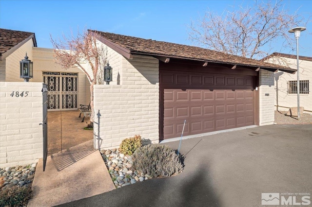 garage with fence