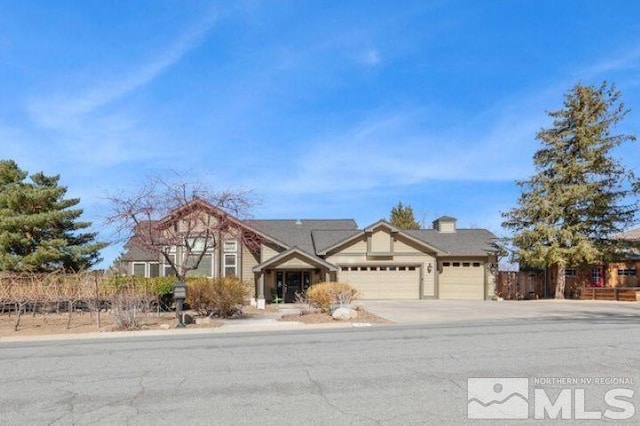 view of front of house featuring a garage and concrete driveway