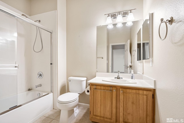 full bath with baseboards, toilet, enclosed tub / shower combo, tile patterned floors, and vanity