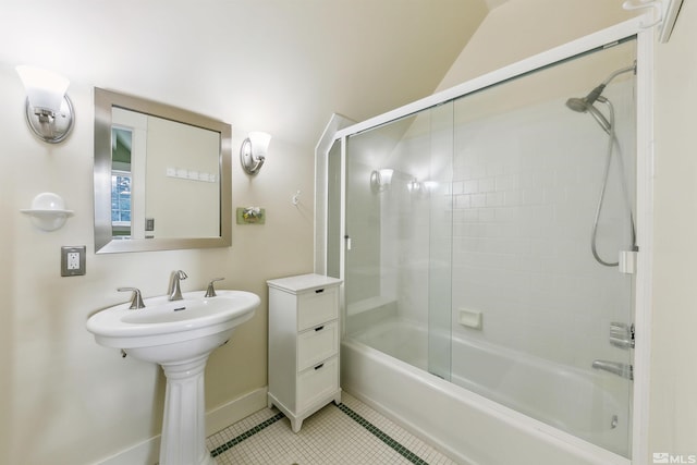 full bath with  shower combination, baseboards, and tile patterned floors