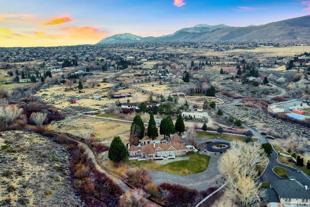 birds eye view of property featuring a mountain view