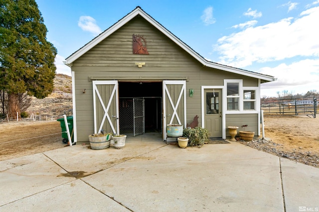 view of outbuilding featuring an outbuilding and an exterior structure