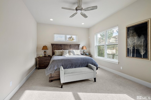 bedroom with recessed lighting, light colored carpet, and baseboards