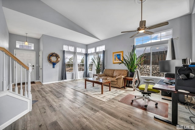 office with high vaulted ceiling, wood finished floors, a ceiling fan, and baseboards