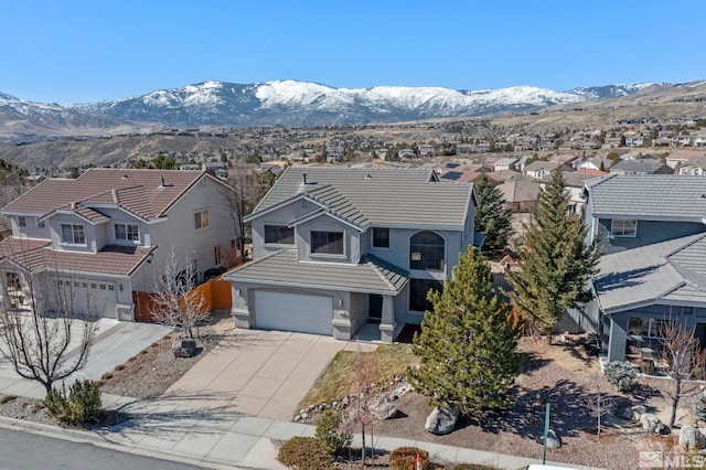 birds eye view of property with a mountain view and a residential view