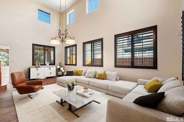 living area with a notable chandelier