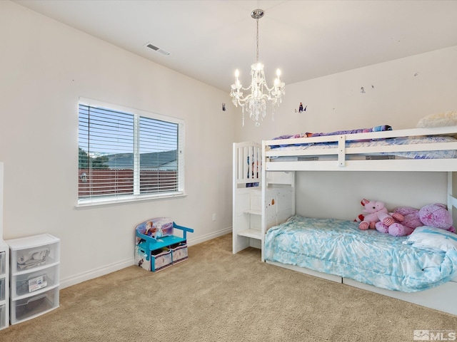 bedroom featuring carpet, visible vents, a chandelier, and baseboards