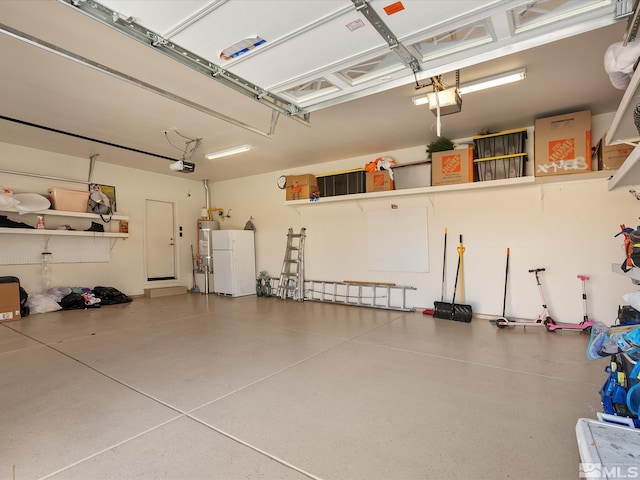 garage with a garage door opener and water heater