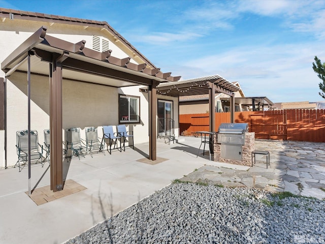 view of patio / terrace featuring a grill, fence, and a pergola