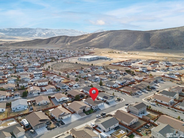 birds eye view of property with a mountain view and a residential view