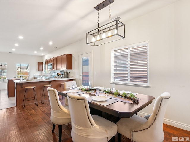 dining area with recessed lighting, dark wood-style flooring, visible vents, and baseboards