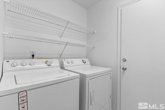 laundry room with laundry area and separate washer and dryer