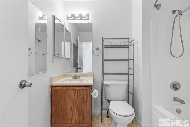 full bath with shower / tub combination, vanity, and toilet