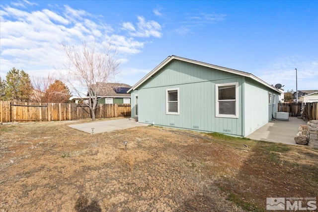 back of house with a patio area and a fenced backyard