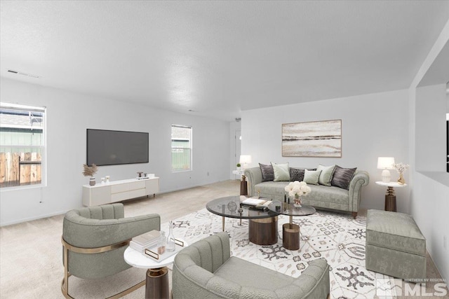 carpeted living room featuring visible vents