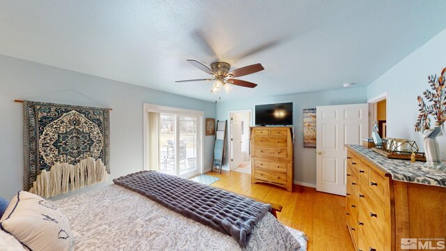 bedroom with light wood-type flooring, baseboards, and a ceiling fan