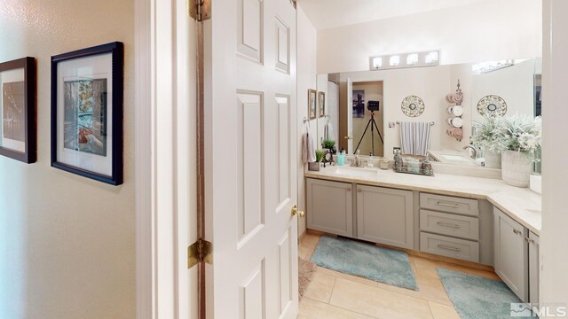 full bathroom featuring vanity and tile patterned floors