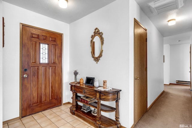 entrance foyer with light tile patterned floors, visible vents, baseboard heating, light carpet, and baseboards