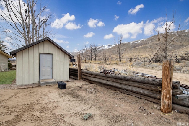 view of outdoor structure with a mountain view and an outdoor structure