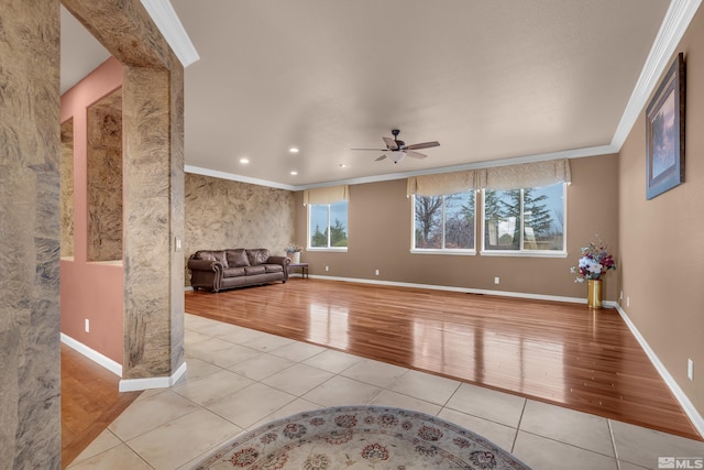 unfurnished living room featuring crown molding, light tile patterned floors, recessed lighting, ceiling fan, and baseboards