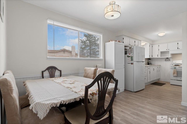 dining space with light wood-style floors