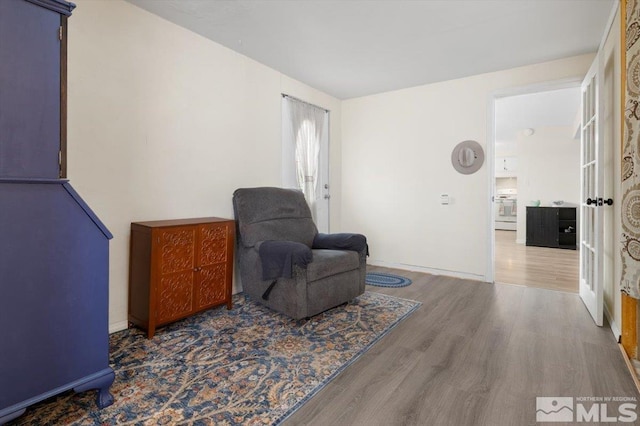 living area with wood finished floors